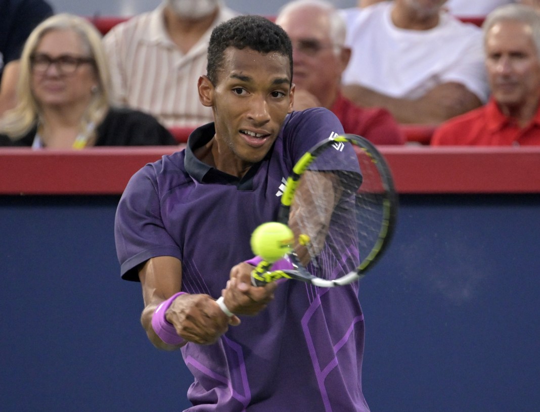 Tennis: National Bank Open-Montreal Felix Auger Aliassime hits a backhand against Flavio Cobolli in Montreal in 2024.