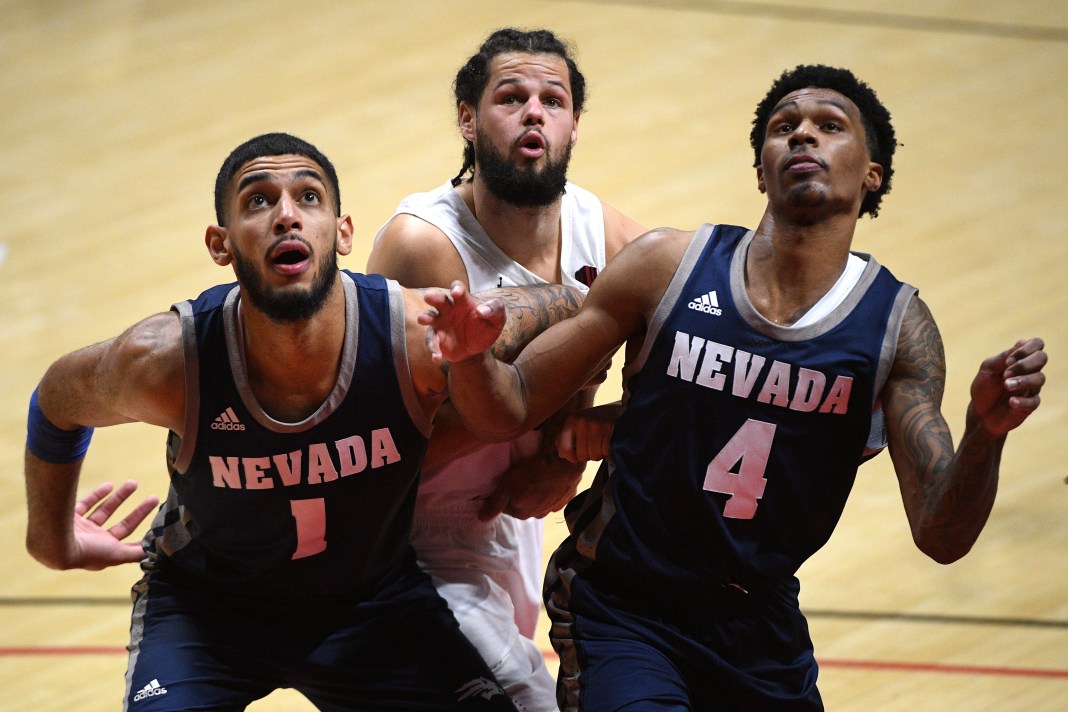 NCAA Basketball: Nevada at San Diego State Nevada Wolf Pack forward Robby Robinson (1) and guard Desmond Cambridge Jr. (4) box out San Diego State Aztecs guard Jordan Schakel (20) during a free throw in the second half at Viejas Arena on January 9, 2021.