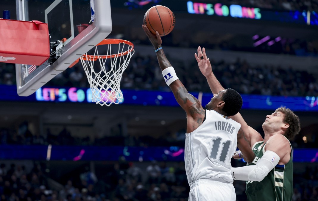 NBA: Milwaukee Bucks at Dallas Mavericks Dallas Mavericks guard Kyrie Irving (11) shoots past Milwaukee Bucks center Brook Lopez (11) during the first half at American Airlines Center on March 1, 2025.