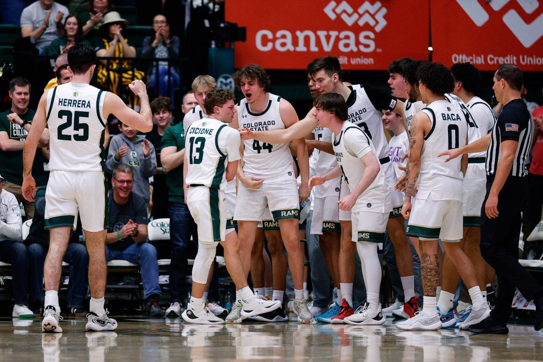 Colorado State Rams guard Bowen Born (13) celebrates with the bench as guard Ethan Morton (25) reacts after a play in the second half against the Utah State Aggies at Moby Arena on March 1, 2025.