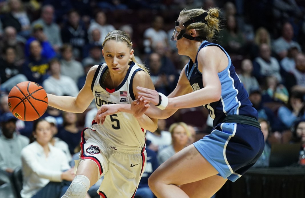 UConn Huskies guard Paige Bueckers (5) drives the ball against Villanova Wildcats guard Maddie Burke (23) in the first half at Mohegan Sun Arena on March 9, 2025.