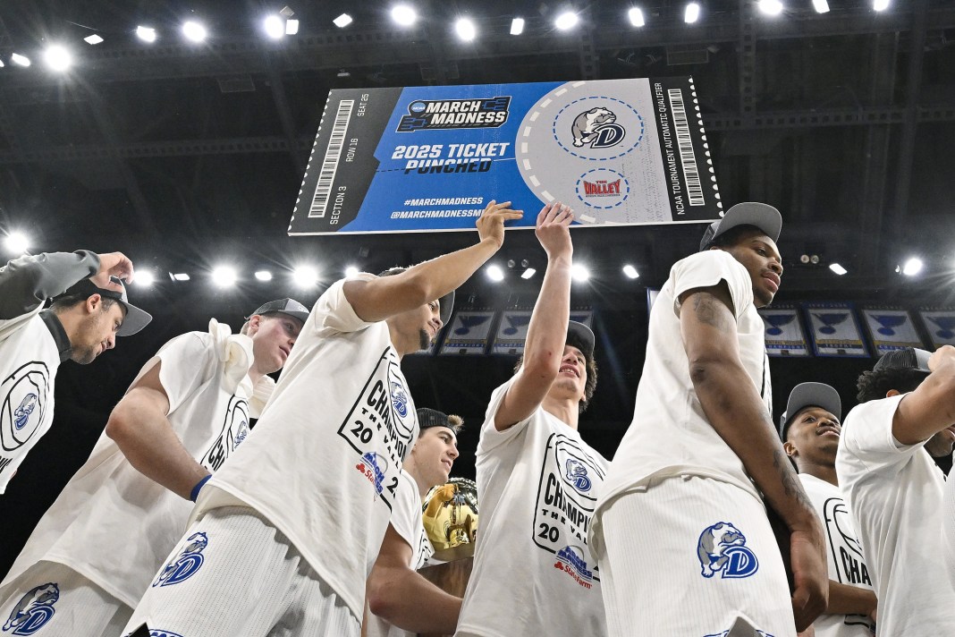 Drake Bulldogs celebrate after defeating the Bradley Braves to win the Missouri Valley Conference Tournament Championship at Enterprise Center on March 9, 2025.