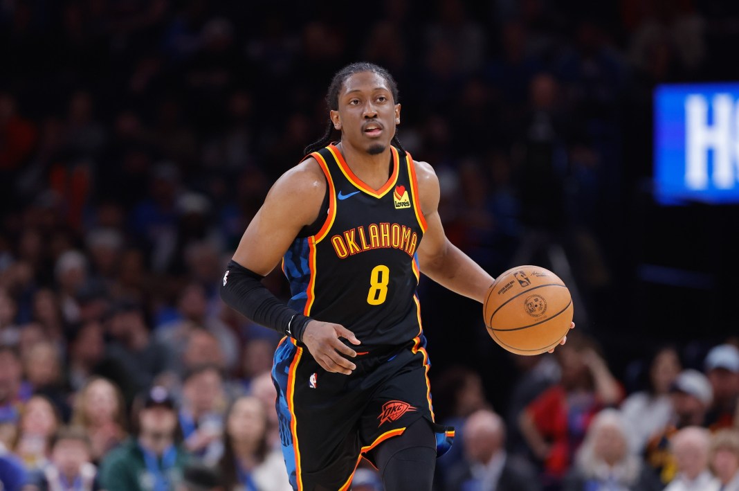 Thunder wing Jalen Williams brings the ball up against the Nuggets during the 2024-25 NBA season.