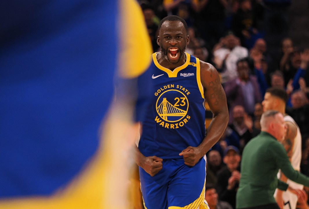 Warriors forward Draymond Green celebrates a big play against the Nuggets during the 2024-25 NBA season.