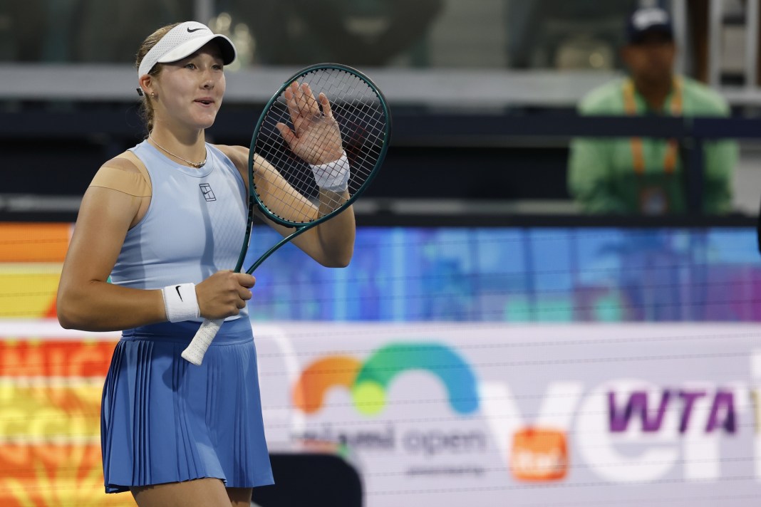 Mirra Andreeva waves to the crowd after a win over Veronika Kudermetova at the 2025 Miami Open.