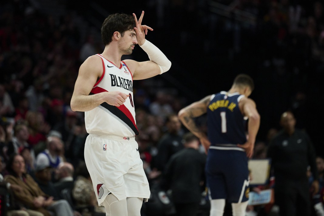 Blazers wing Deni Avdija celebrates a 3 against the Nuggets during the 2024-25 NBA season.