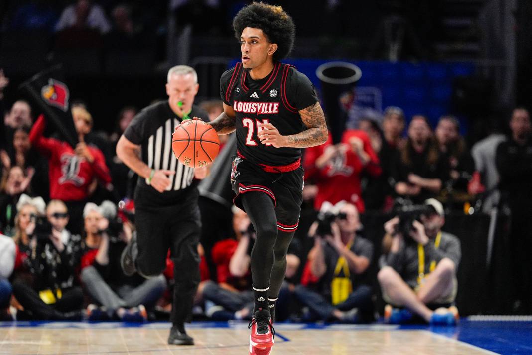 Louisville Cardinals guard Chucky Hepburn (24) brings the ball up court against the Duke Blue Devils during the 2025 ACC Conference Championship game at Spectrum Center on March 15, 2025.