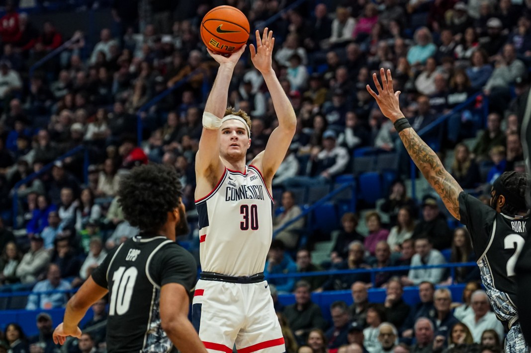 UConn Huskies forward Liam McNeeley (30) shoots against the Georgetown Hoyas in the first half at XL Center on February 26, 2025.