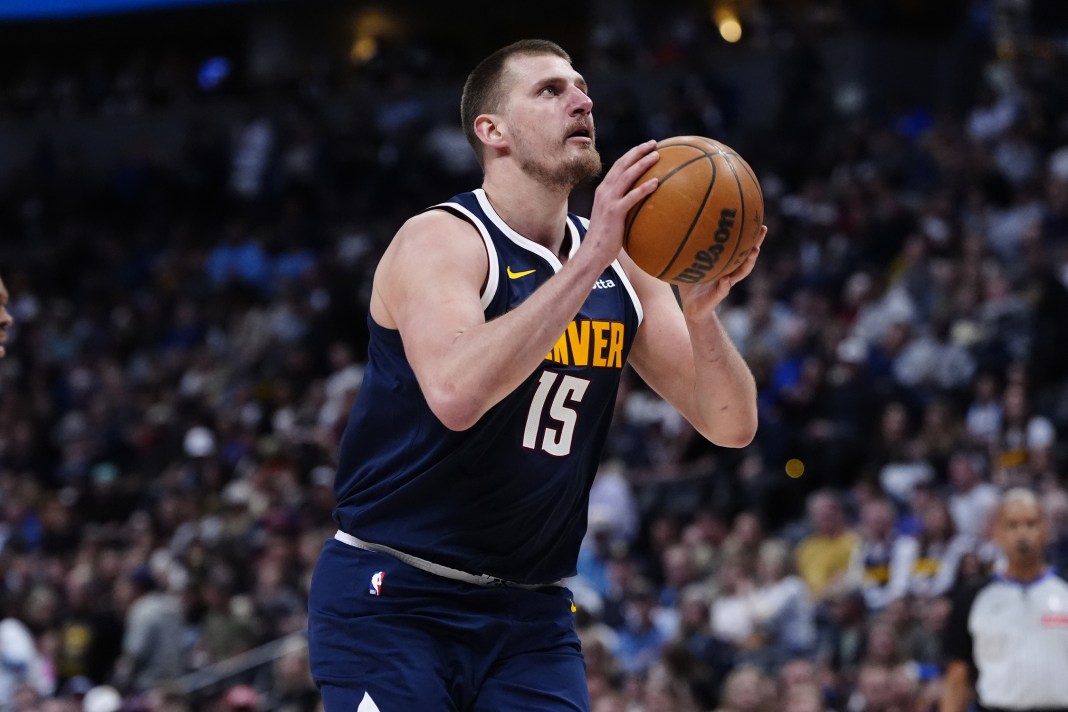 Denver Nuggets center Nikola Jokic (15) prepares to shoot the ball in the second half of the game against the Utah Jazz at Ball Arena in Denver, Colorado, on March 28, 2025.