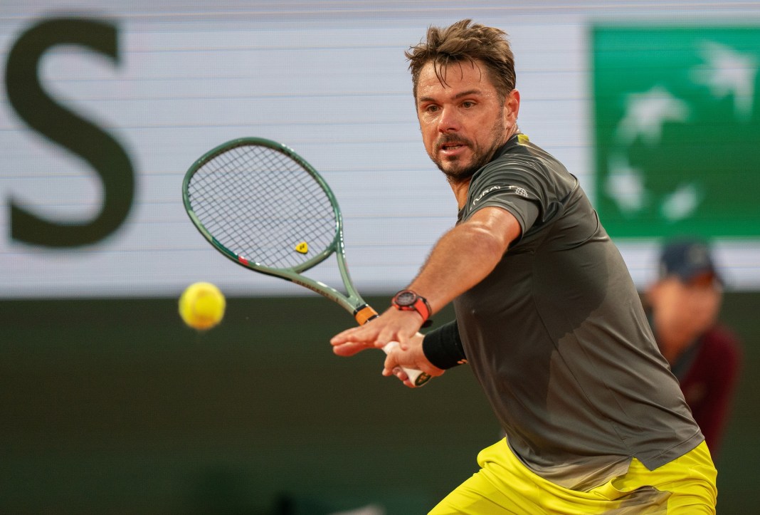 Stan Wawrinka hits a forehand against Andy Murray at the 2024 French Open.