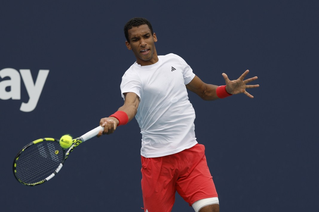Felix Auger-Aliassime hits a forehand against Lorenzo Musetti during the 2025 Miami Open.