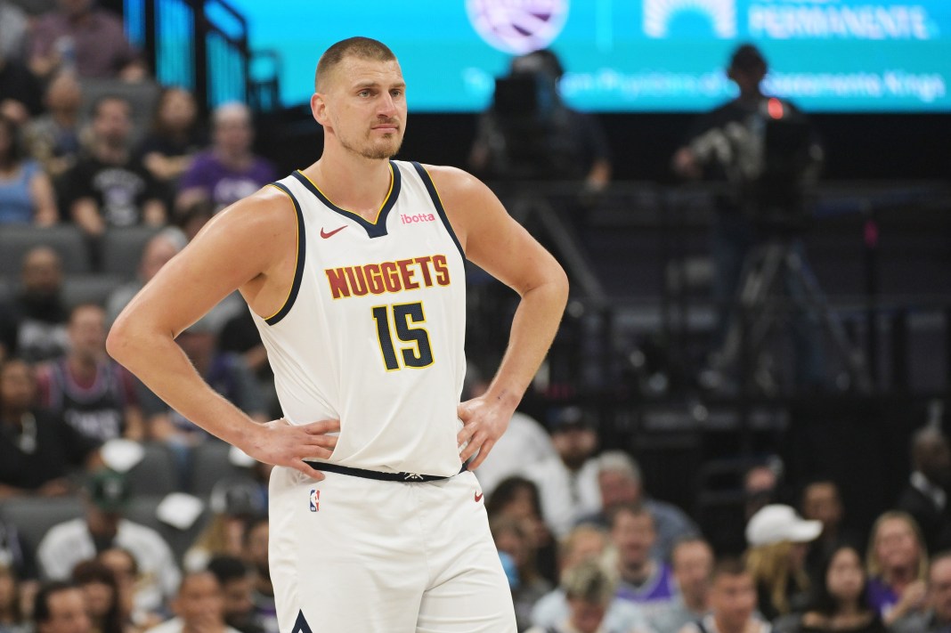 Nuggets star Nikola Jokic looks on during a meeting with the Kings during the 2024-25 NBA season.