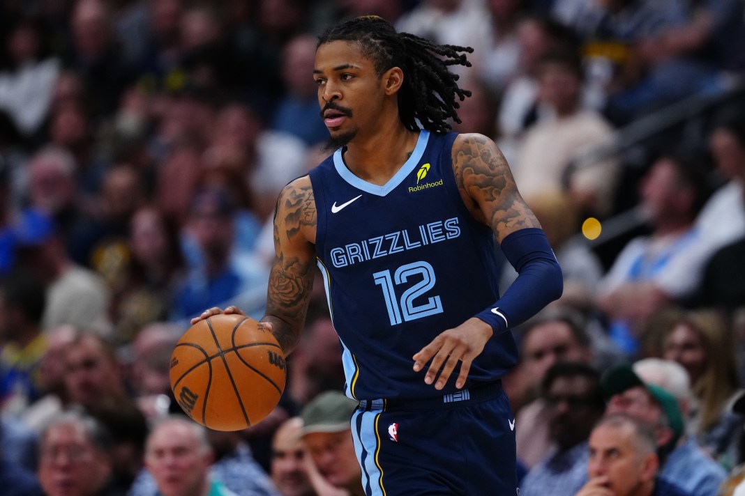 Grizzlies star Ja Morant brings the ball up against the Nuggets during the 2024-25 NBA season.