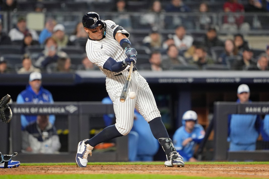 New York Yankees right fielder Aaron Judge (99) hits a single during the seventh inning of the game against the Kansas City Royals at Yankee Stadium in the Bronx, New York, on April 14, 2025.