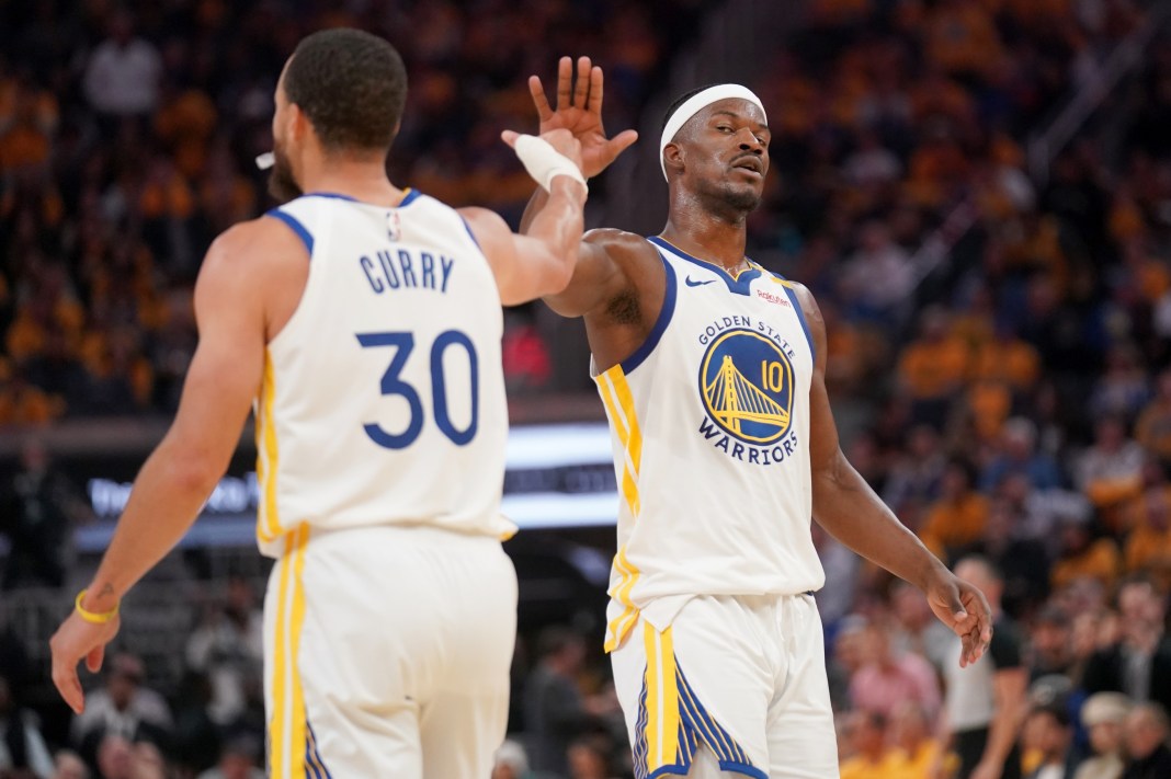 NBA: Play-In-Memphis Grizzlies at Golden State Warriors Warriors stars Stephen Curry and Jimmy Butler high five during a meeting with the Grizzlies in the 2024-25 NBA season.