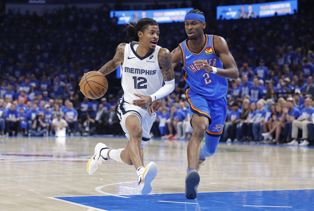 Grizzlies star Ja Morant drives on Thunder star Shai Gilgeous-Alexander during the 2024-25 NBA Playoffs.