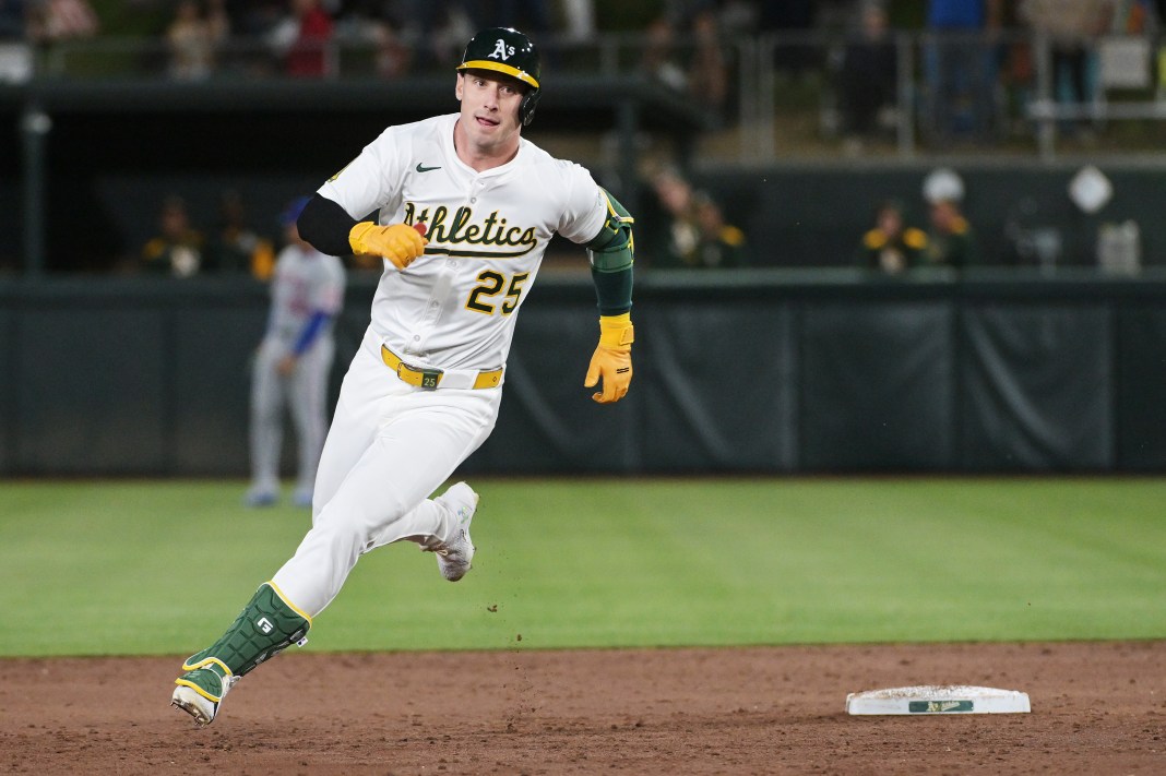 Oakland Athletics outfielder Brent Rooker (25) rounds second base on his way to third after hitting a triple during the third inning of the game against the New York Mets at Sutter Health Park in West Sacramento, California, on April 11, 2025.
