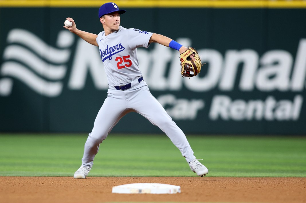Los Angeles Dodgers outfielder Tommy Edman (25) throws to first base during the fourth inning of the game against the Texas Rangers at Globe Life Field in Arlington, Texas, on April 18, 2025.