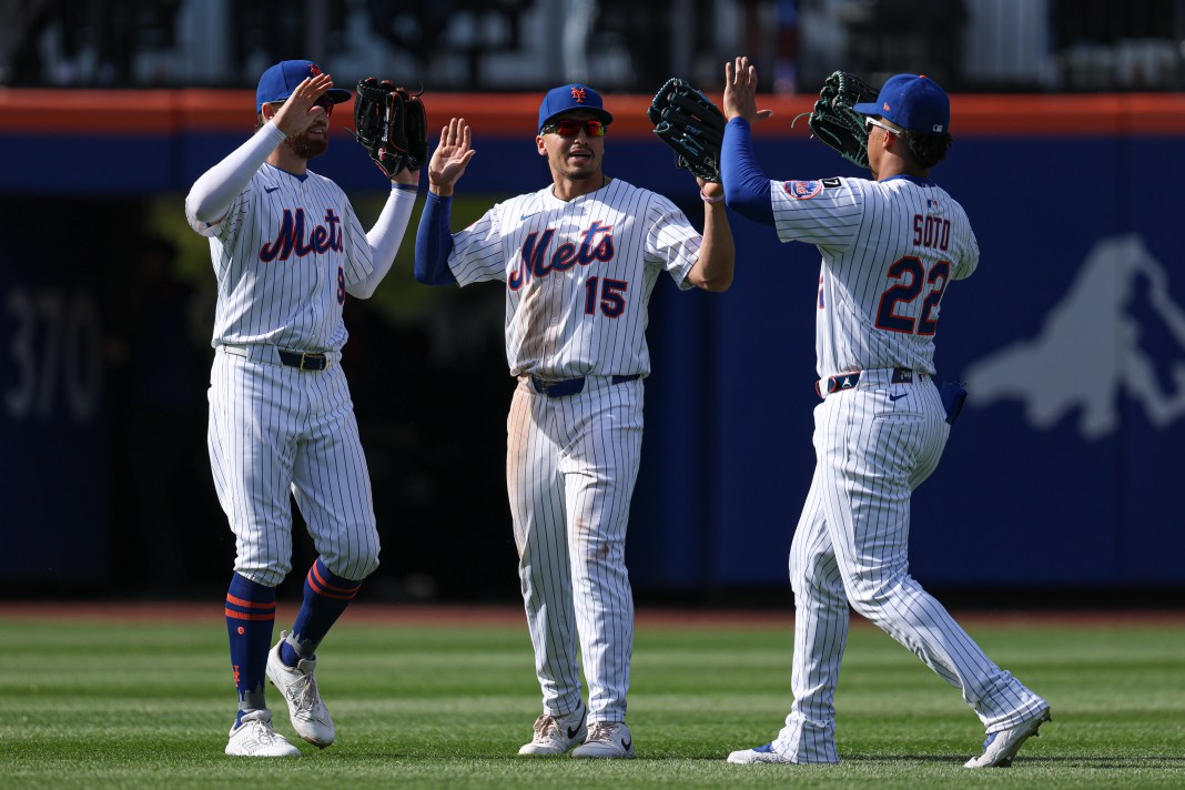 New York Mets left fielder Brandon Nimmo (9), right fielder Tyrone Taylor (15), and right fielder Juan Soto (22) celebrate after defeating the St. Louis Cardinals at Citi Field in New York City, New York, on April 20, 2025.