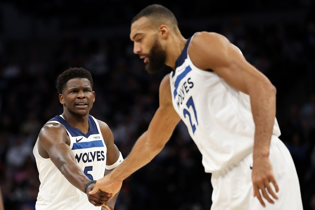 NBA: Detroit Pistons at Minnesota Timberwolves Timberwolves stars Anthony Edwards and Rudy Gobert greet during the 2024-25 NBA season.