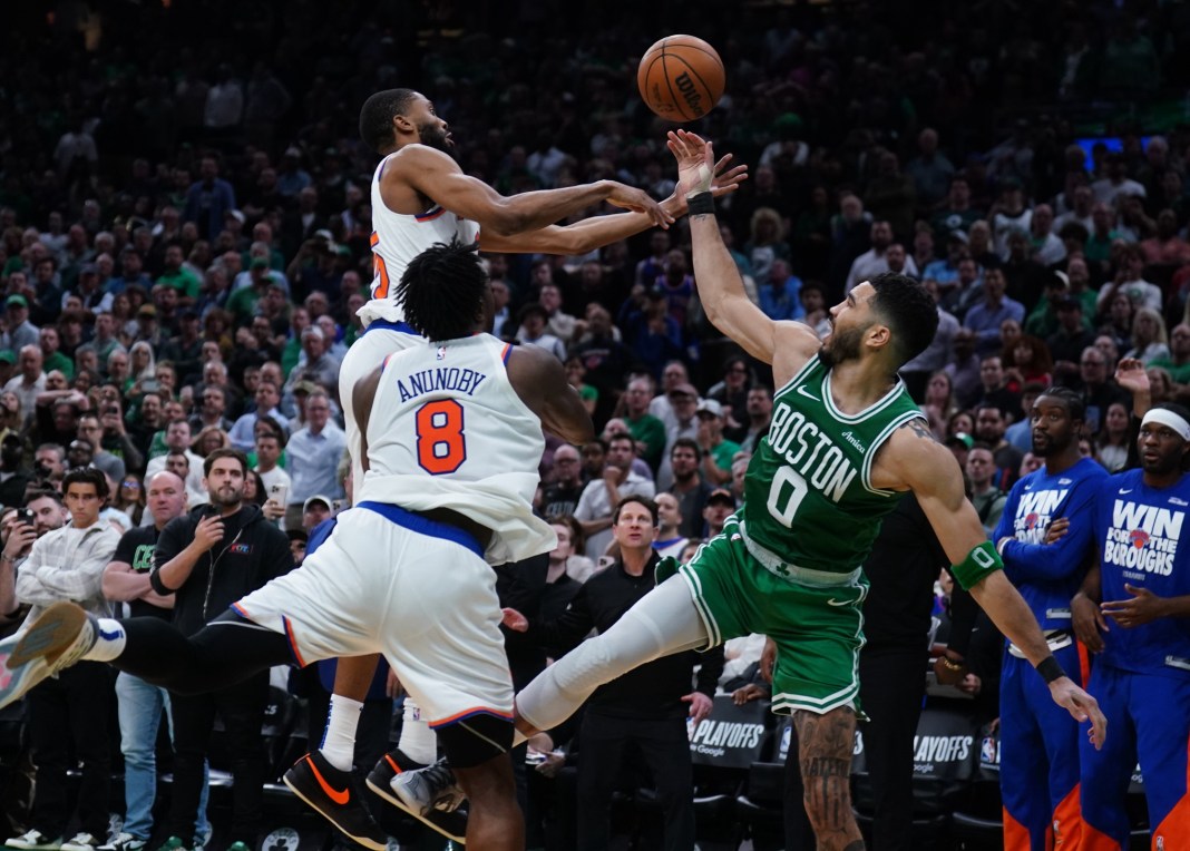 Celtics star Jayson Tatum loses the ball against the Knicks during the 2024-25 NBA Playoffs.