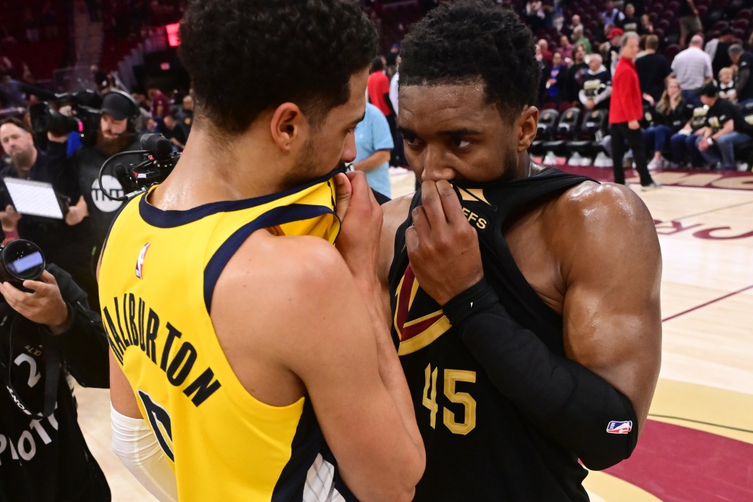 Indiana Pacers guard Tyrese Haliburton (0) talks to Cleveland Cavaliers guard Donovan Mitchell.