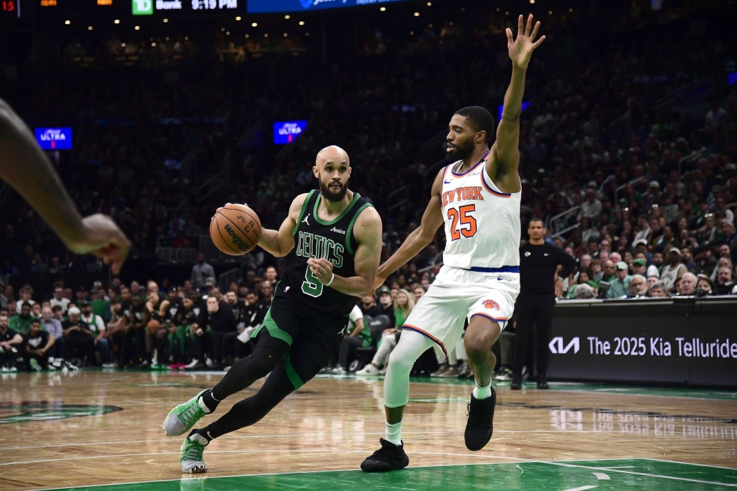 NBA: Playoffs-New York Knicks at Boston Celtics Celtics guard Derrick White drives on Mikal Bridges during the 2024-25 NBA Playoffs.