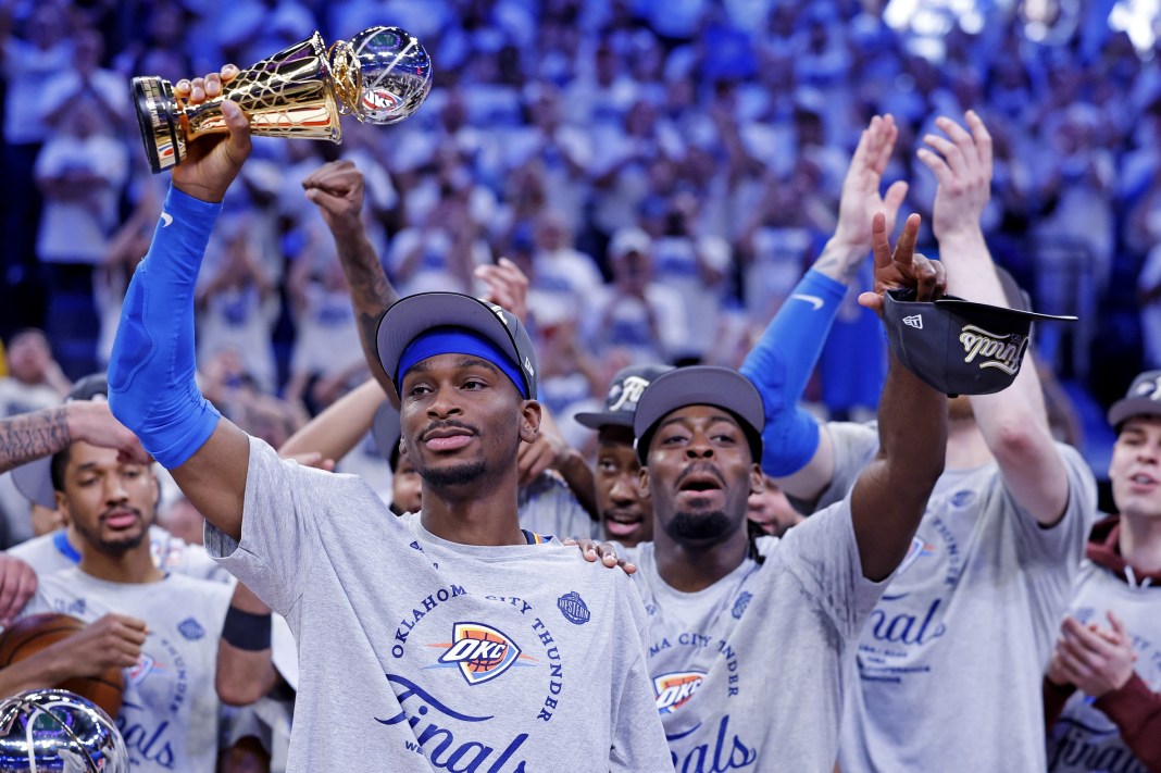 Oklahoma City Thunder guard Shai Gilgeous-Alexander (2) celebrates with the Magic Johnson Western Conference Finals MVP trophy after defeating the Minnesota Timberwolves in game five to win the Western Conference Finals for the 2025 NBA Playoffs at Paycom Center in Oklahoma City, Oklahoma, on May 28, 2025.