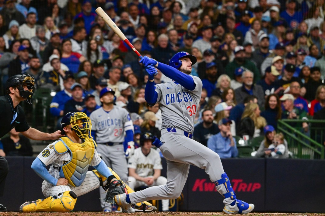 Chicago Cubs right fielder Kyle Tucker (30) hits a solo home run in the fifth inning as Milwaukee Brewers catcher William Contreras (24) looks on at American Family Field in Milwaukee, Wisconsin, on May 3, 2025.