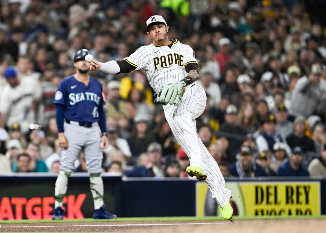 San Diego Padres third baseman Manny Machado (13) throws to first but does not get the out against Seattle Mariners left fielder Randy Arozarena (56) during the sixth inning at Petco Park in San Diego, California, on May 16, 2025.