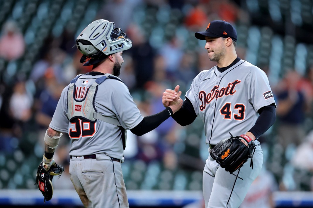 Detroit Tigers catcher Tomas Nido (58) shakes hands with Detroit Tigers pitcher Tommy Kahnle (43) following the final out of the game against the Houston Astros during the ninth inning at Daikin Park in Houston, Texas, on April 30, 2025.