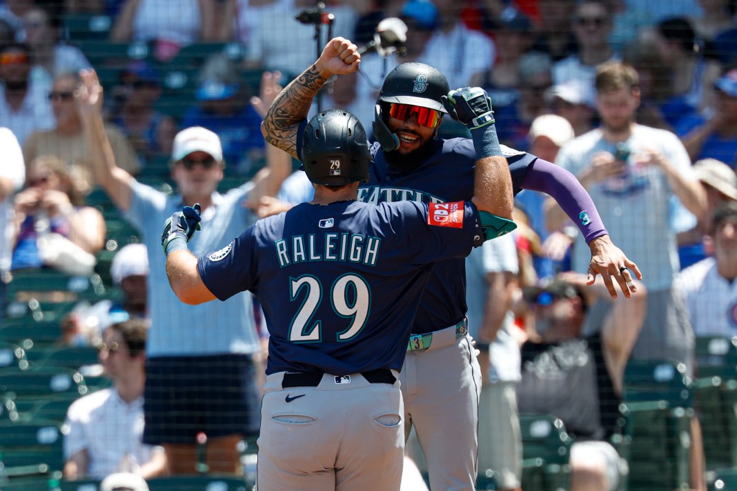 MLB: Seattle Mariners at Chicago Cubs Seattle Mariners designated hitter Cal Raleigh (29) celebrates with shortstop J.P. Crawford (3) after hitting a two-run home run against the Chicago Cubs during the first inning at Wrigley Field in Chicago, Illinois, on June 22, 2025. Mandatory Credit: Kamil Krzaczynski-Imagn Images.