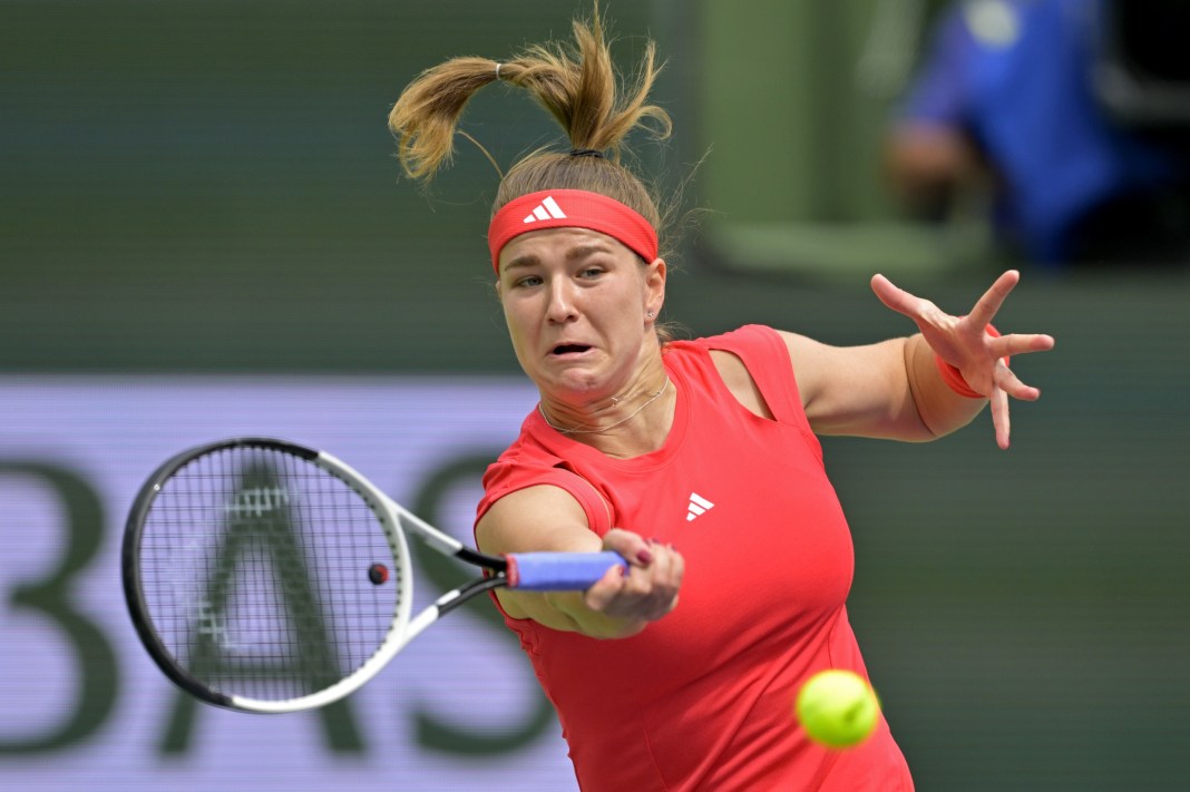 Karolina Muchova hits a forehand against Iga Swiatek at the 2025 BNP Paribas Open in Indian Wells.