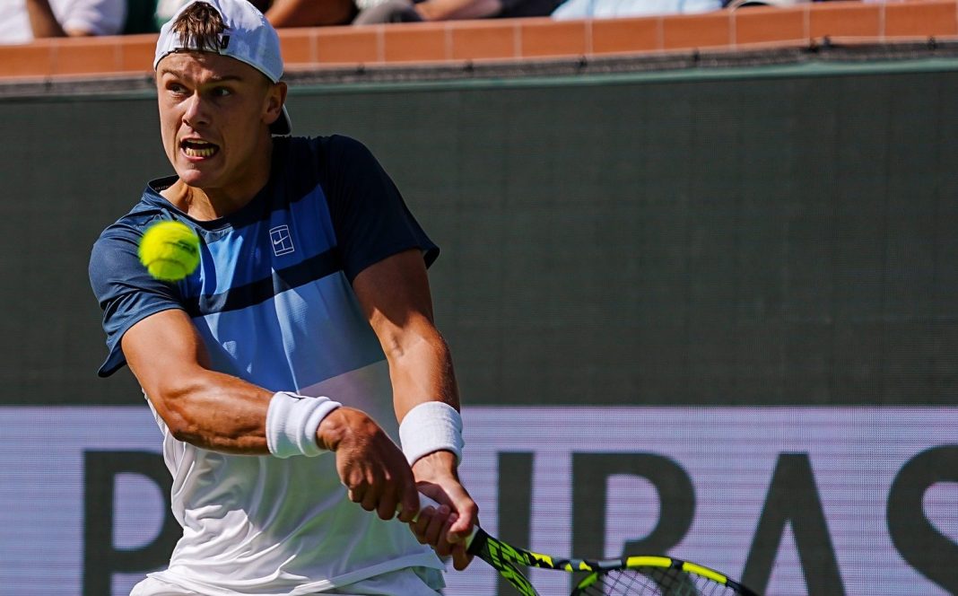 Syndication: Desert Sun Holger Rune hits a backhand in a match against Jack Draper in the 2025 BNP Paribas Open final in Indian Wells.