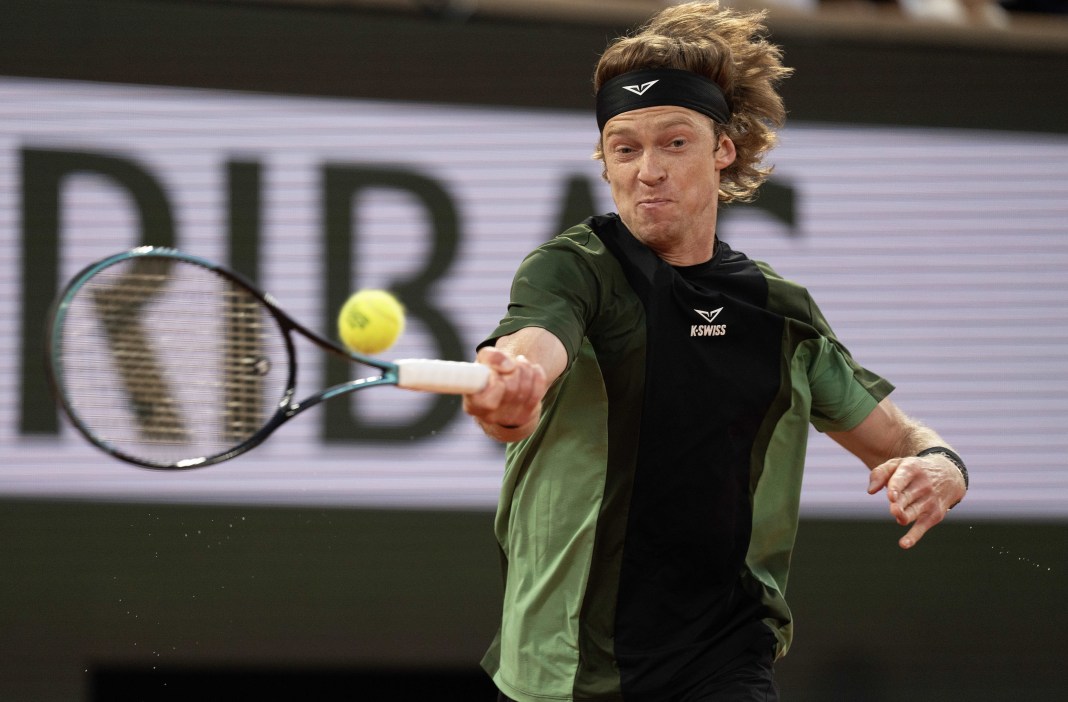 Tennis: French Open Andrey Rublev hits a forehand against Jannik Sinner at the 2025 French Open at Roland Garros.