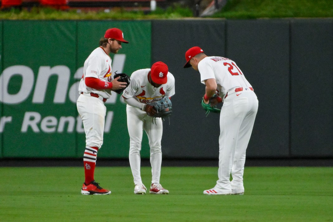 St. Louis Cardinals left fielder Brendan Donovan (33), center fielder Victor Scott II (11), and right fielder Lars Nootbaar (21) celebrate after the Cardinals defeated the Washington Nationals at Busch Stadium on July 8, 2025.