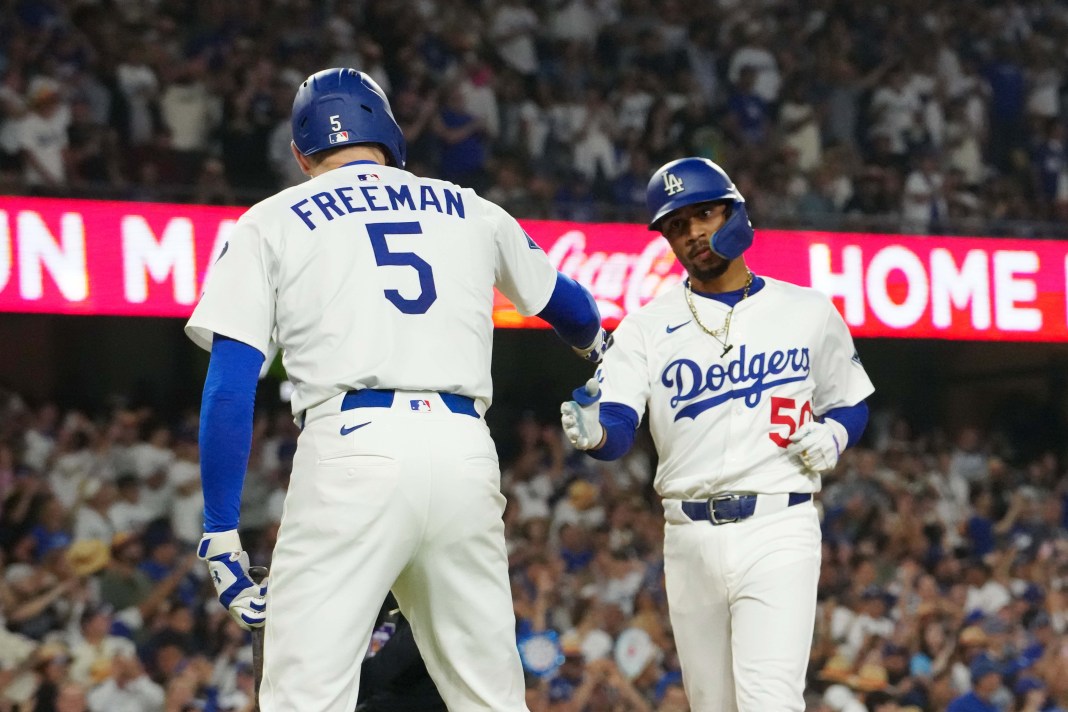 Los Angeles Dodgers shortstop Mookie Betts (50) is congratulated by first baseman Freddie Freeman (5) after hitting a home run in the seventh inning against the Chicago White Sox at Dodger Stadium on July 3, 2025.