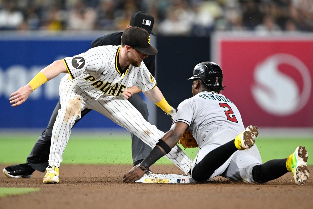 Arizona Diamondbacks shortstop Geraldo Perdomo (2) is tagged out by San Diego Padres second baseman Jake Cronenworth (9) as he attempts to steal second base during the eighth inning at Petco Park on July 7, 2025.