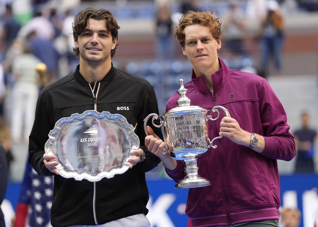 Jannik Sinner and Taylor Fritz pose with their trophies after the 2024 US Open in Flushing Meadows, New York.