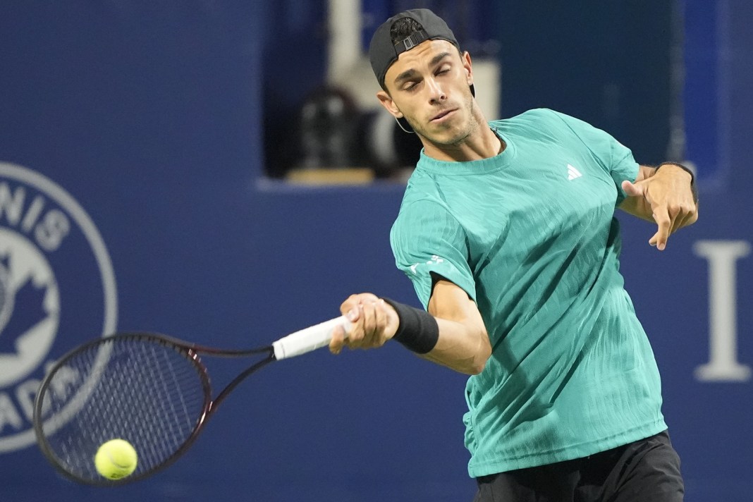 Francisco Cerundolo hits a forehand against Alexander Zverev at the 2025 National Bank Open in Canada.