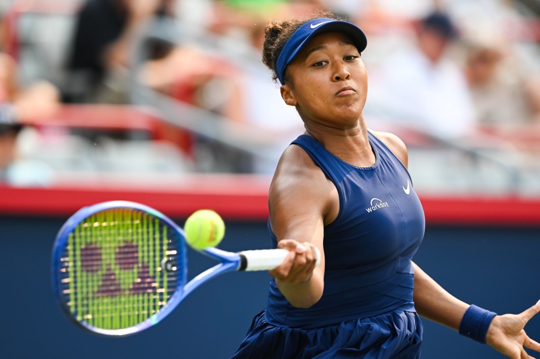 Naomi Osaka hits a forehand against Anastasija Sevastova at the 2025 National Bank Open in Montreal.