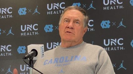 North Carolina head coach Bill Belichick talks at a press conference before the 2025 college football season.