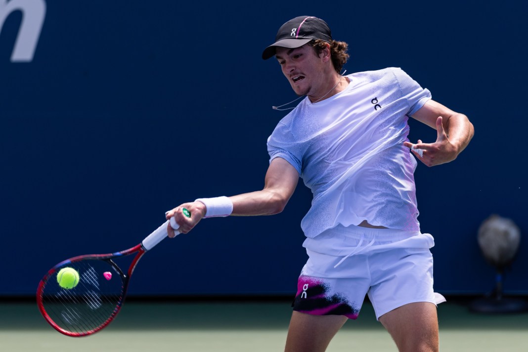 Joao Fonseca hits a forehand in his match against Miomir Kecmanovic at the 2025 US Open.