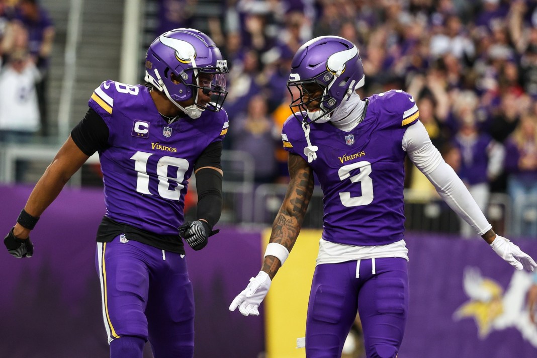Vikings wide receivers Justin Jefferson and Jordan Addison celebrate a touchdown against the Falcons during the 2024 NFL season.