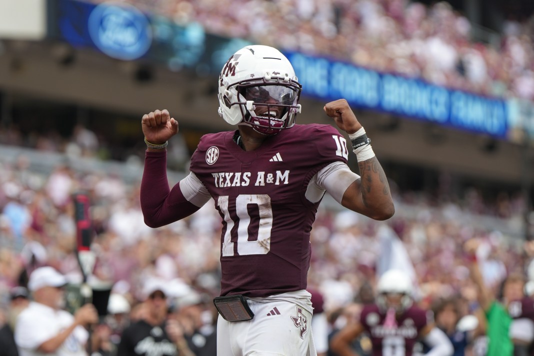 Texas A&M quarterback Marcel Reed celebrates a touchdown pass during a game against Utah State in the 2025 college football season.