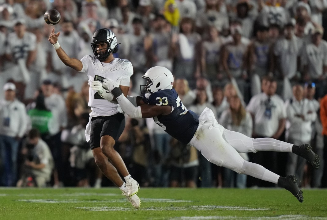 Oregon quarterback Dante Moore attempts to throw against Penn State during the 2025 college football season.