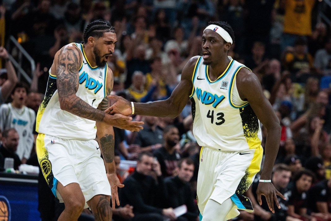 Pacers star Pascal Siakam high fives Obi Toppin in a game against the Cavaliers during the 2024-25 NBA Playoffs.