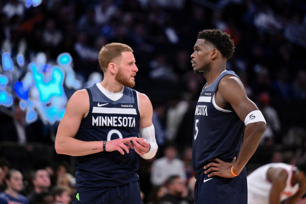 Timberwolves superstar Anthony Edwards talks to Donte DiVincenzo during a 2025-26 NBA preseason game against the Knicks.