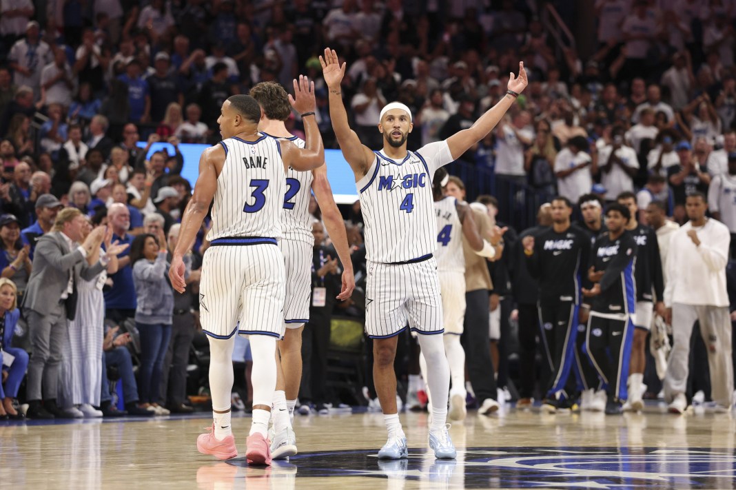Orlando Magic players react to a play against the Miami Heat during the 2025-26 NBA season.