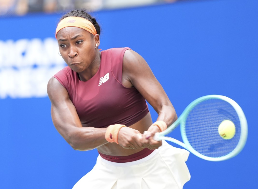 Coco Gauff hits a backhand against Naomi Osaka at the 2025 US Open.